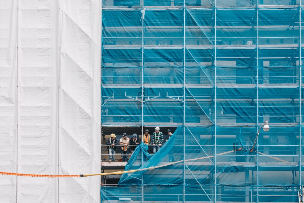 Builders chatting on scaffolding