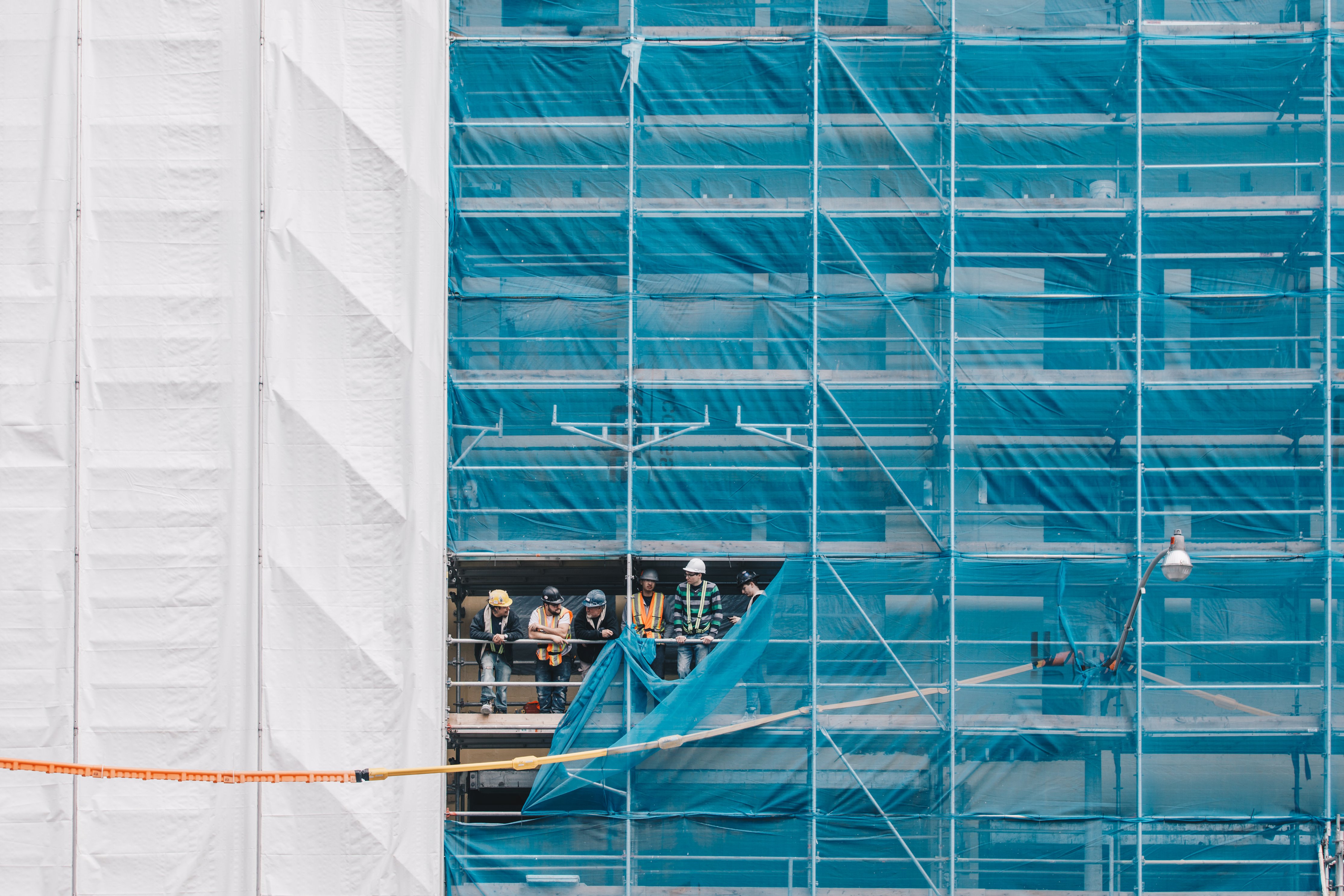 Builders on scaffolding