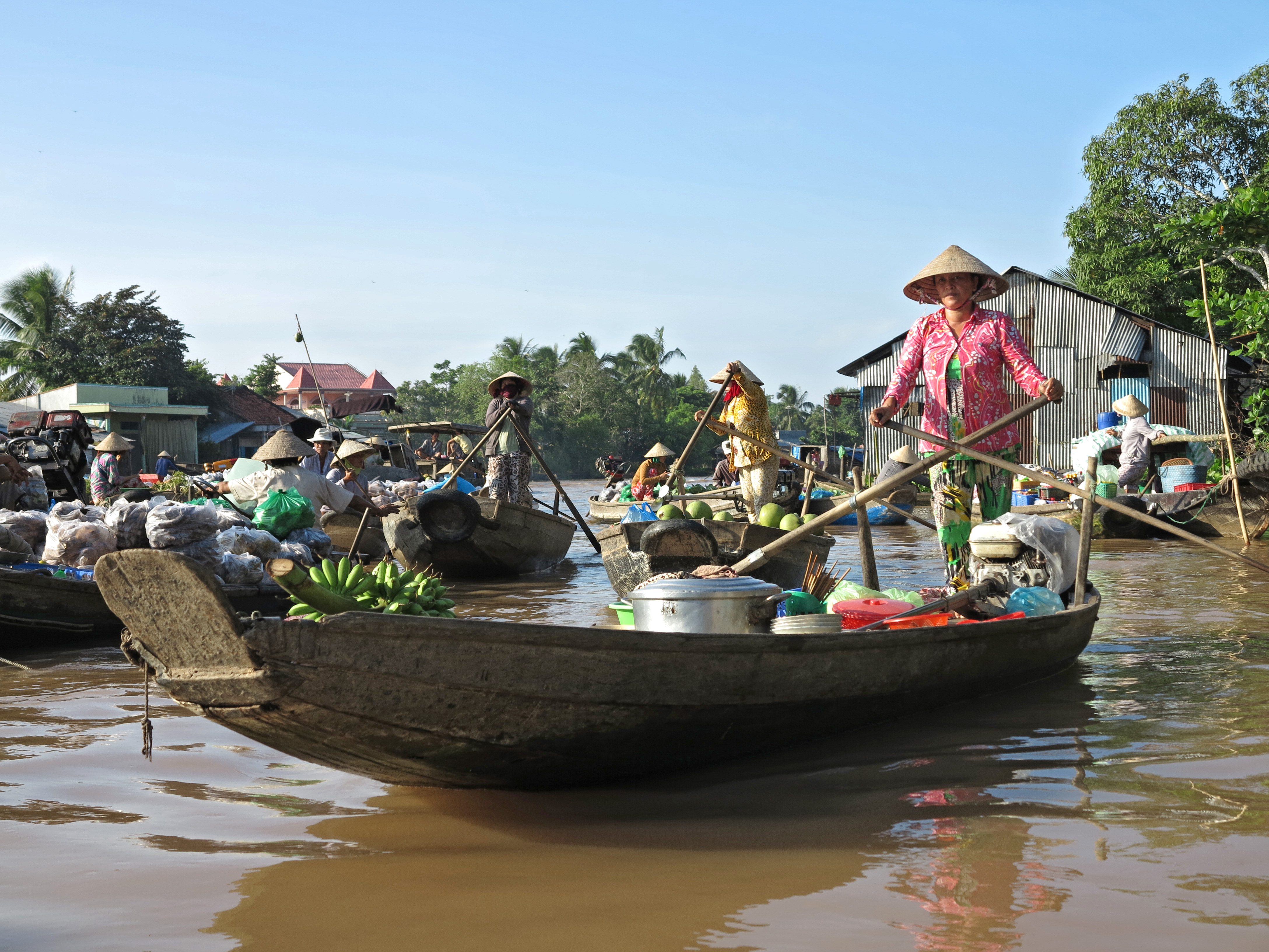 merchant on boat in Vietnam